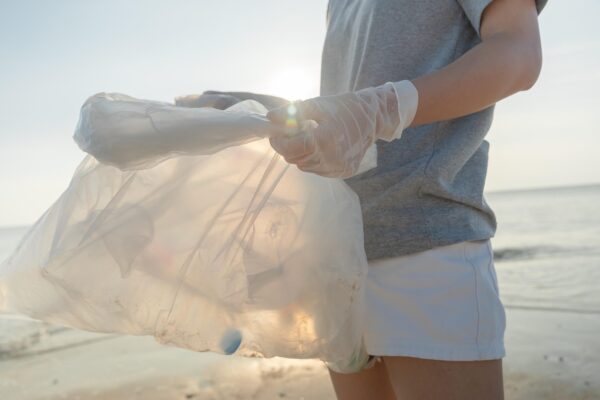 A person collecting plastic